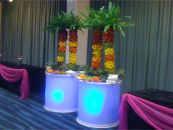 Four Fruit Palm Trees on illuminated stands at Delicious Fruits & Fountains Client Event